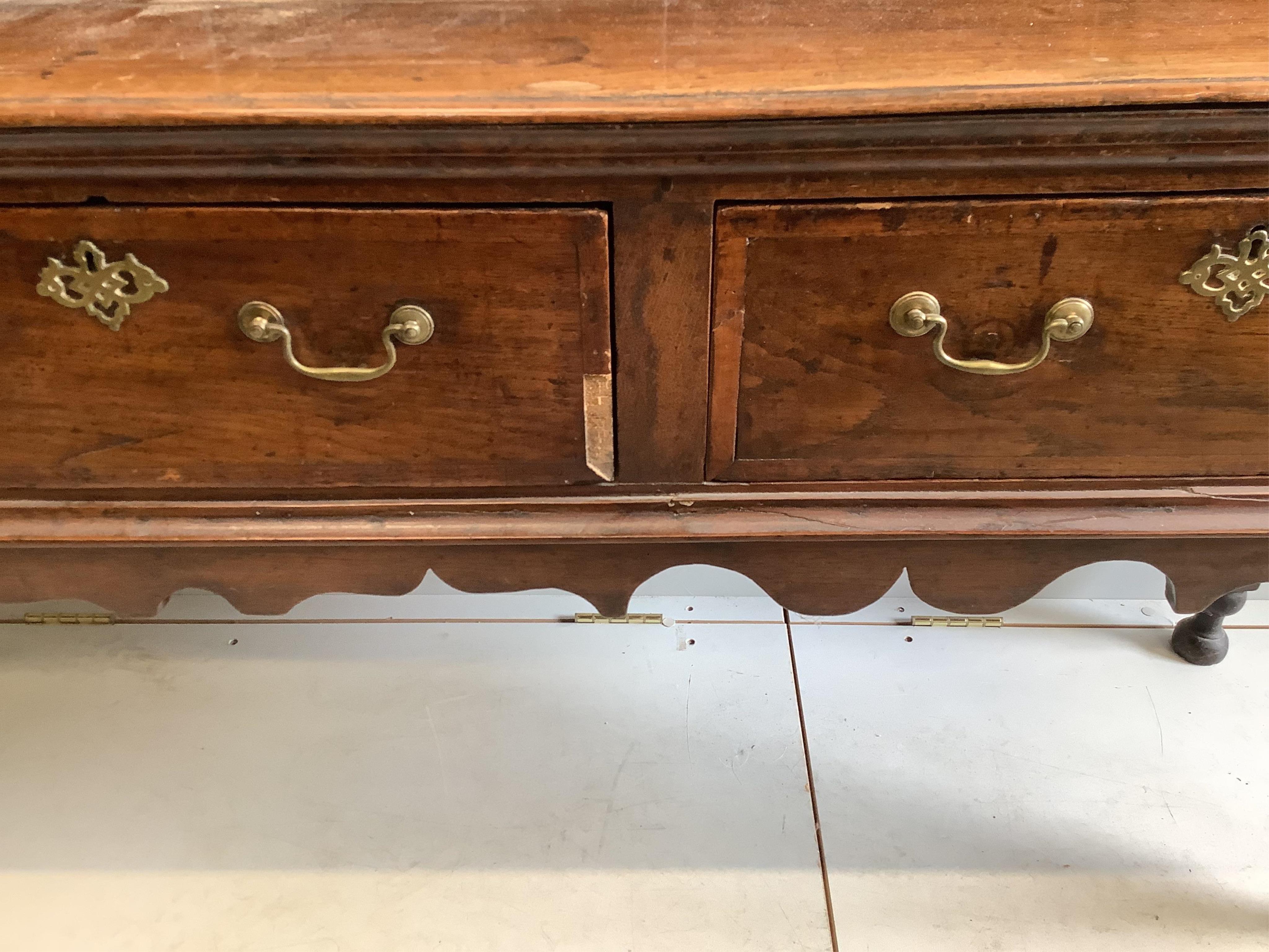 A mid 18th century oak low dresser, width 207cm, depth 46cm, height 97cm. Condition - fair